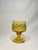 There's Mid Century Modern vibe amongst these amber gold colored glass goblets. The set of 8 consists intricate scroll-...