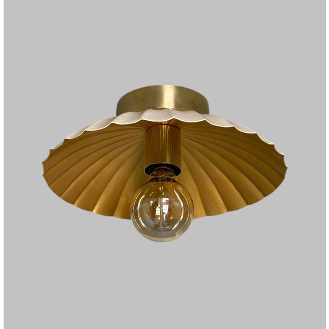 Elevate your space with timeless elegance and warm illumination using this 12-inch flush mount ceiling light. Featuring a...