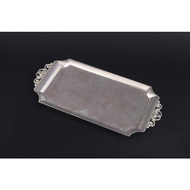 Georg Jensen. Sterling silver tray, model 305B. Rectangular sterling silver tray with shaped corners and openwork scroll...
