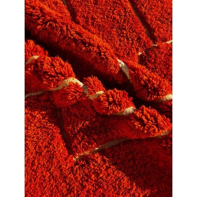 Brighten your space with this luxurious handmade Mrirt rug in a deep burnt orange hue, crafted with love and precision in...