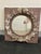 Once belonging to Tory Burch, this unique mirror is a reclaimed wooden window encrusted with an ornate, concrete wreath....
