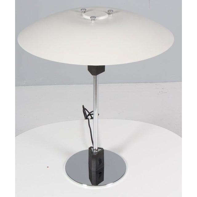 Poul Henningsen PH 4/3 with two lacquered aluminium shades. Made in chrome and plast. Made in the 1990's. This piece is...