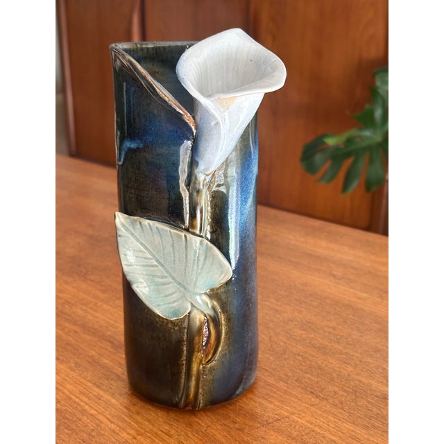 Important vintage stoneware vase with a blue camaieu glaze and slip-decorated design of an arum lily and celadon green...
