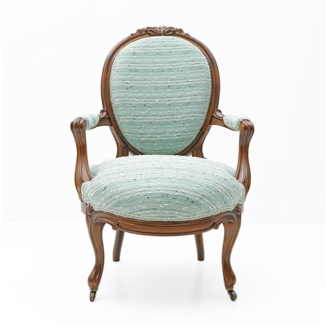 This elegant pair of 19th-century Louis-Philippe style armchairs embodies timeless sophistication and exquisite...