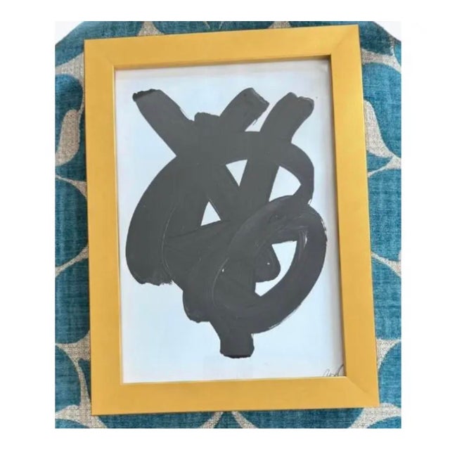 Striking glossy black abstract paintings on white, custom-framed in new Larson Juhl gold painted solid wood frames,...