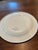 Vintage enamelware plate in the Louise pattern by Robert Steffy, San Francisco, dated 1988. Cream background with floral...