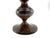 A vintage metal urn vase in a classic trophy form, featuring a richly aged, mottled patina in deep brown and black tones...