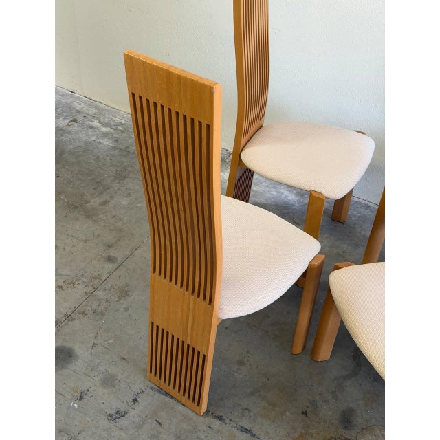 These striking chairs feature very tall architectural slatted backs that create a dramatic vertical presence while...