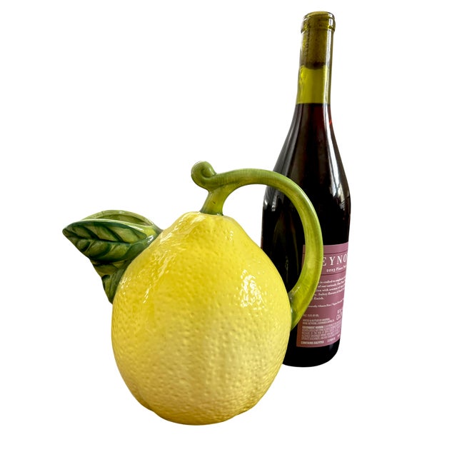 Bring a splash of Mediterranean sunshine and coastal charm to your space with this vintage Italian majolica lemon pitcher....