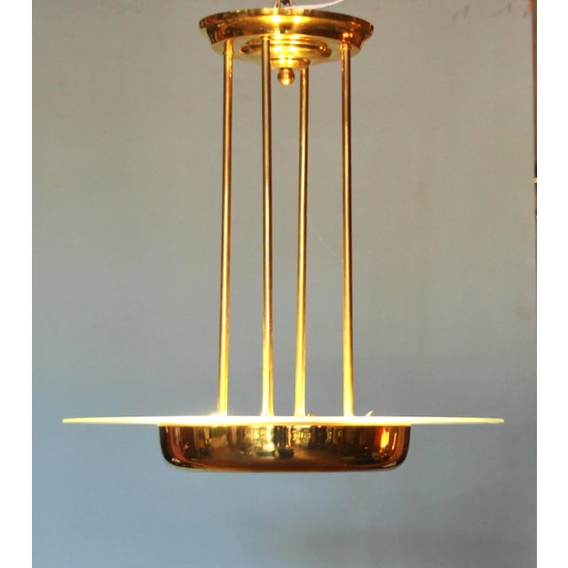 This round Art Deco chandelier probably comes from. from Petitot is made of solid brass and a partially etched glass panel...