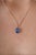 This solitaire pendant feature 3.23 carats of oval blue sapphires set in 14K white gold. The sapphire measuring 7 x 9.8...