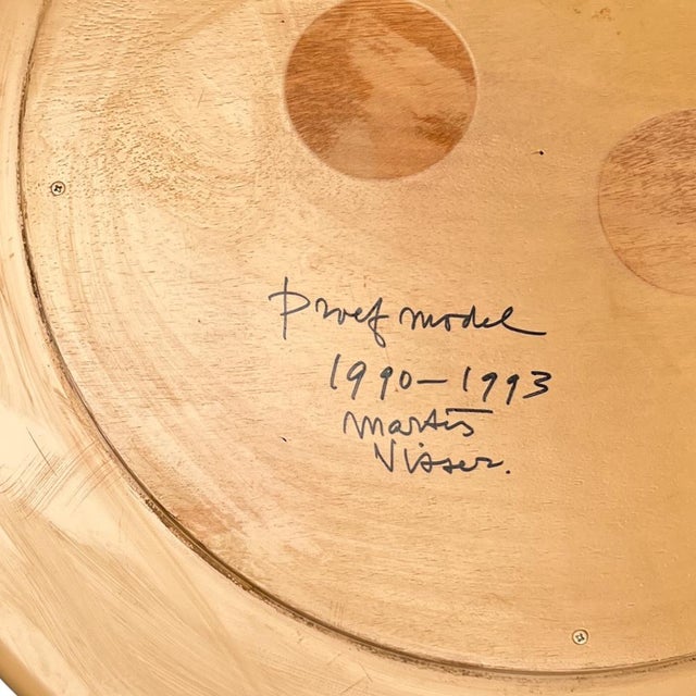 Martin Visser’s *Rollo* table (1991) is a striking example of late postmodern design, blending functionality with...