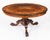 This is a stunning and rare antique Victorian marquetry loo table, circa 1860 in date. Thestriking burr walnut top has the...