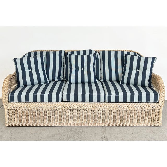 Henry Link Rattan Sofa with New Sunbrella Upholstery and Cushions Offered for sale is a Henry Link rattan and woven wicker...