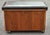 A Lane Furniture trunk crafted for use as a record cabinet and Bench. Original black Naugahyde upholstered top. Divided...