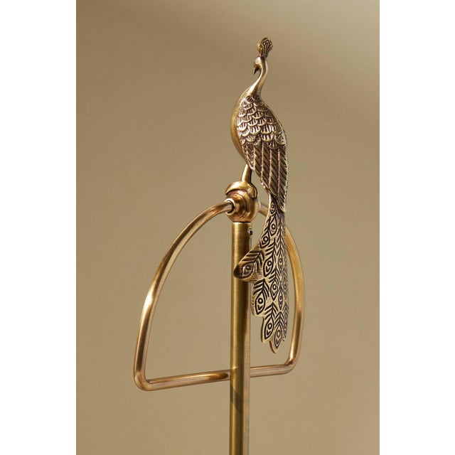 Elegant and sculptural, this set of two freestanding peacock towel stands by Anthropologie brings a refined vintage-...