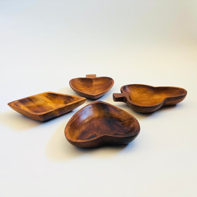 A set of 4 mid century wood dishes, each in the shape of a different card suit. Beautiful grain to the wood. Perfect for...
