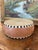 Vintage handcrafted frame drum featuring what is most likely a natural rawhide drumhead stretched over a rounded possibly...