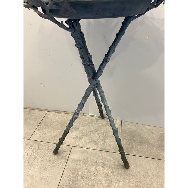 This cast aluminum bird bath has a weathered Verdigris finish