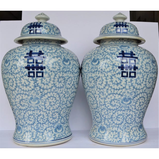 These are a pair of contemporary large blue & white Chinese porcelain temple / ginger jars. These large Baluster vase has...