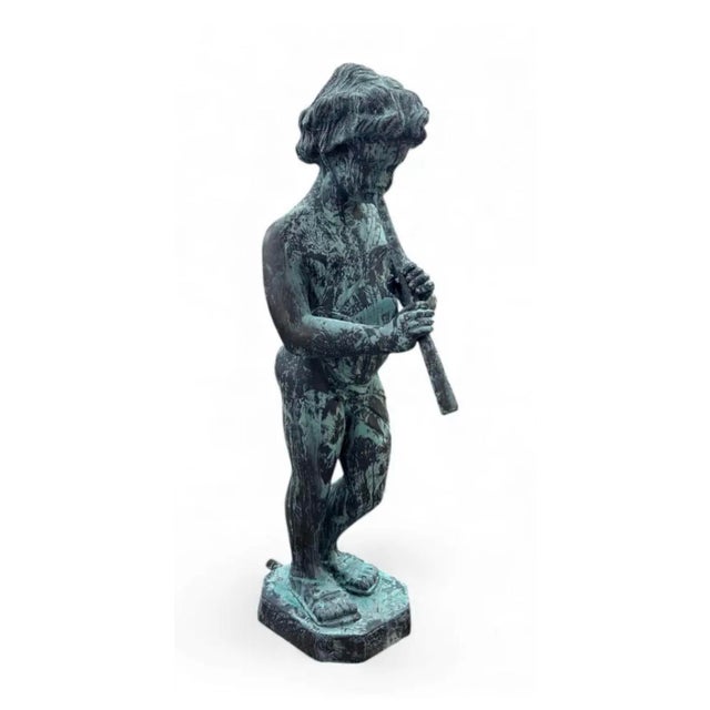 Add a touch of pastoral charm and musical tranquility to your garden or interior space with this captivating Piping Boy...