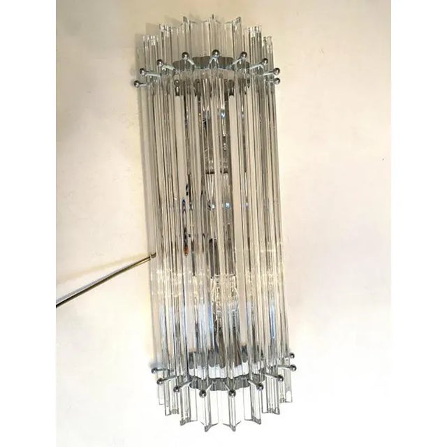 Contemporary trasparent triedro murano glass wall sconce. Very elegant , very bright. metal frame in chromed plating bath....