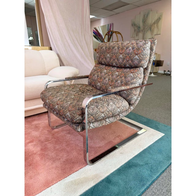 A fabulous 1970’s chrome flat bar cantilever lounge chair with multicolor upholstered scoop back. This is a dreamy soft...
