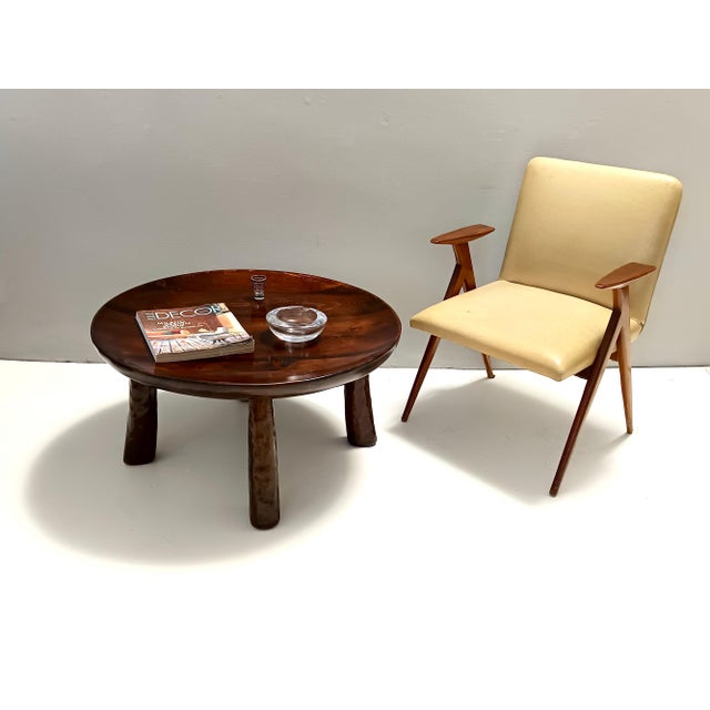 Made in Italy, 1950s. This round coffee table is handmade in beech. It is probably inspired to Niemeyer's stools. This is...