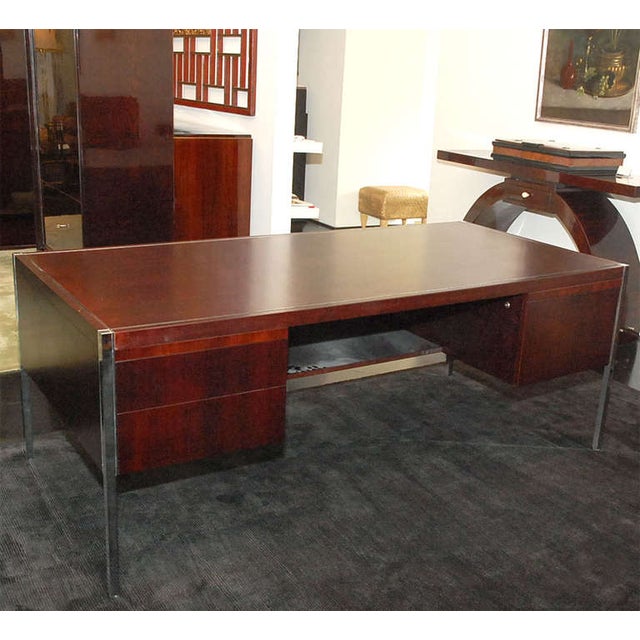 Beautiful mahogany Knoll desk with chrome detailing and legs. Unique, clean and architectural piece. Plentiful storage...