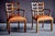 Pair of Art Deco armchairs with solid wood frames with sculptural, wavy openwork backrests. Crafted in solid wood with a...