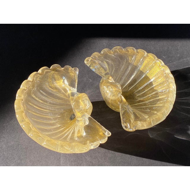 An absolutely stunning pair of 1950s shell-shaped Murano glass bowls with internal gold fleck by Barovier & Toso.