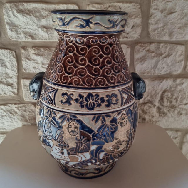 Hoa Vietnam good vase in polychrome enameled sandstone decorated with wise and geometric friezes. Ovoid with neckline and...