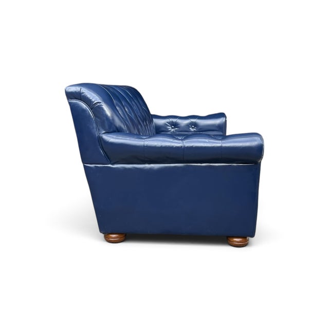 A bold expression of vintage luxury, this navy blue leather sofa combines generous proportions, deep cushioning, and...