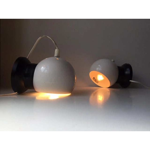 This pair of vintage wall or bedside globe shaped lights was manufactured and designed by E. S. Horn in Denmark during the...