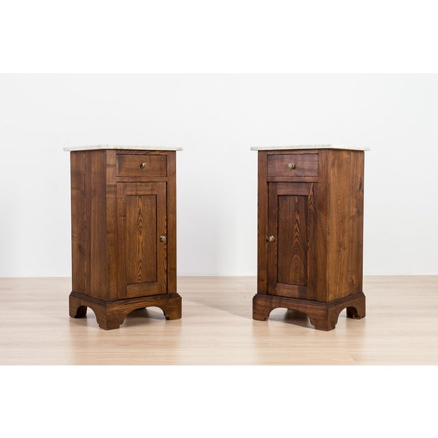 An elegant pair of German Art Nouveau (Jugendstil) bedside cabinets, crafted from solid ash and dating to circa 1910....