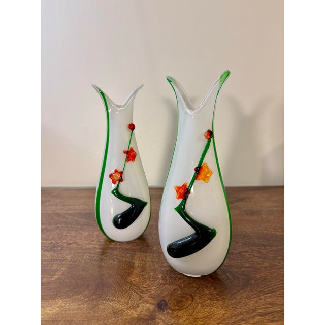 Pair of Italian hand blown art glass vases. Beautiful stark white body's with green accent colors. Green and red glass...