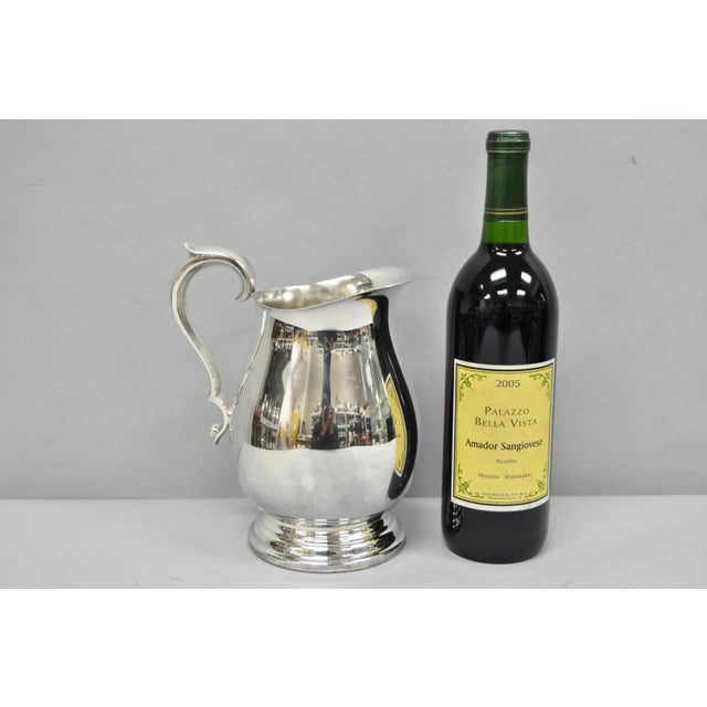 Vintage Reed & Barton 1969 Silver Plated 3.25 Pt. Bulbous Water Pitcher. Circa Mid 20th Century. Measurements: 8.5" H x 7"...