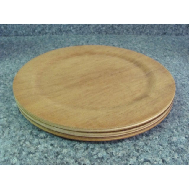 Set of three teak dinner plates. Made in Sweden. Stamped on the underside: ARY, KORM AB, NYBRO, Made in Sweden. These were...