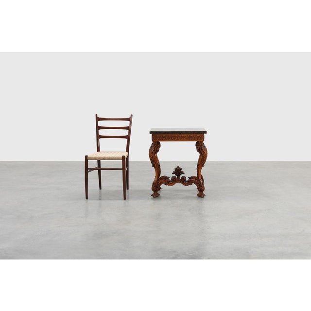 A refined example of late 19th‑century french craftsmanship, this napoleon iii style side table combines sculptural...