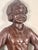 A charming pair of antique figural cast iron statues representing a traditional Dutch boy and girl, manufactured in the...