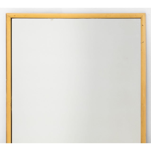 Mid-Century Modern Yellow Painted Wood Mirror. Mirror plate: 42.25" H x 33.5" W; frame: 48.5" H x 36" W x 1" D....