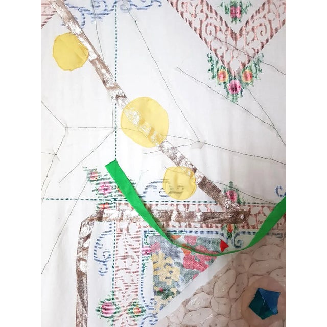 The o.T. 002 wall hanging features a figurative application of fabric fragments with silk, lace, hand embroidery, and...