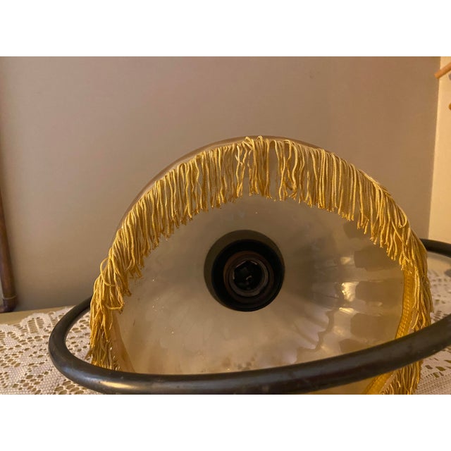 A striking vintage French ceiling pendant attributed to SEE Delmas, featuring an elegant sculptural solid brass frame,...