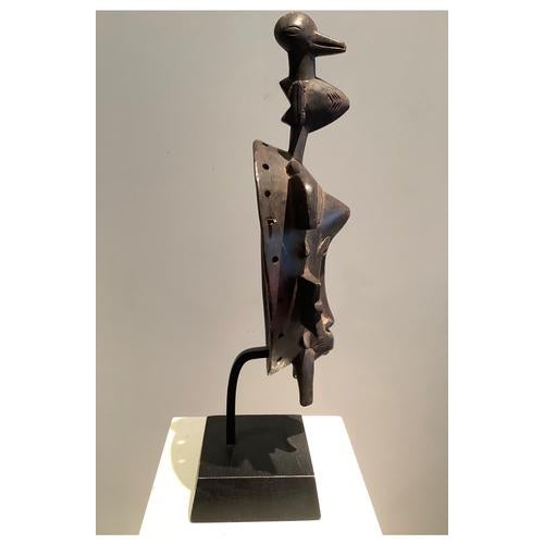 Senufo mask Hard wood, beautiful patina of use Dimensions: Mid XXth Classic Senufo mask with feminine features, oval face,...