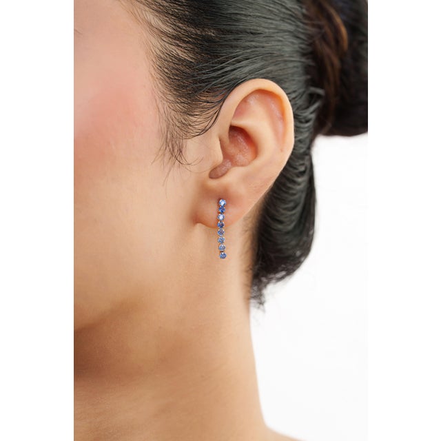 Elegant, timeless, and effortlessly sophisticated, these blue sapphire drop earrings are designed to add a touch of...