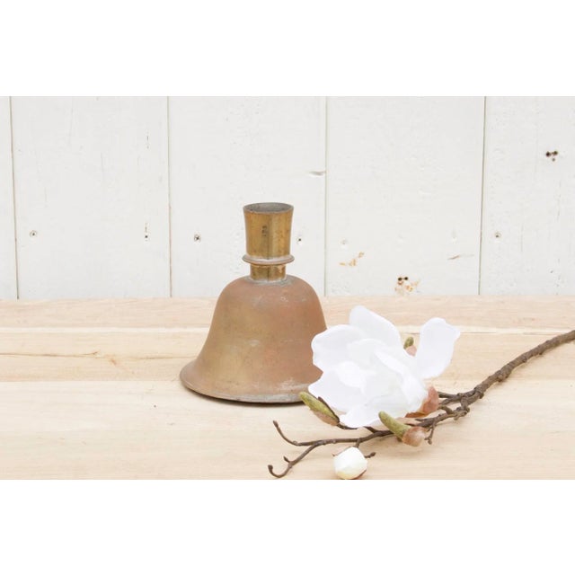 This exclusive 19th century metal flower base is bell-shaped and made from brass This beautiful antique Indian candlestick...