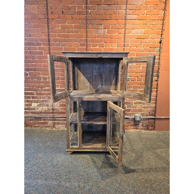 Enhance your home with the timeless character of this Handcrafted Reclaimed Teak Cabinet. Built from authentic, salvaged...