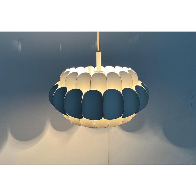 Imposant light from Temde after a draft H. Zender from the 1960s. Due to the similarity of the design, this lamp is often...