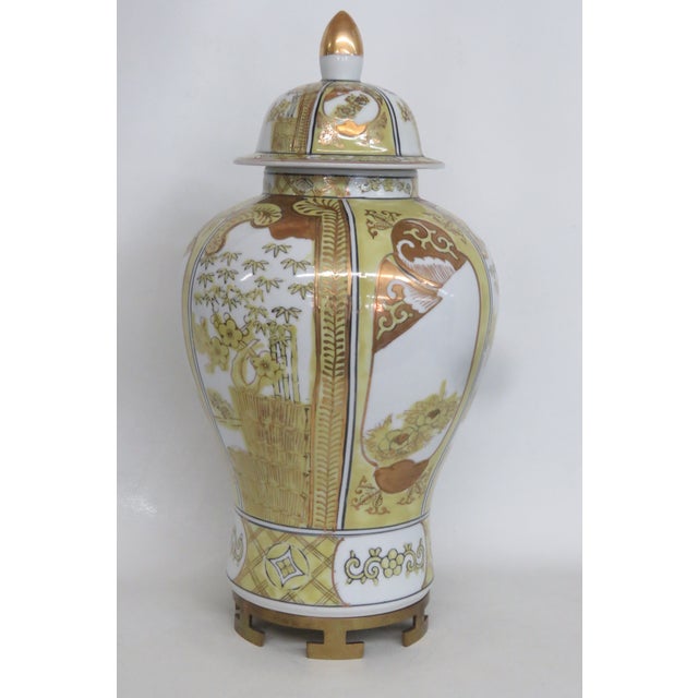 This gorgeous Large Lidded Ginger Jar is made out of porcelain. This dazzling jar presents a tapered rounded silhouette,...
