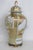 This gorgeous Large Lidded Ginger Jar is made out of porcelain. This dazzling jar presents a tapered rounded silhouette,...